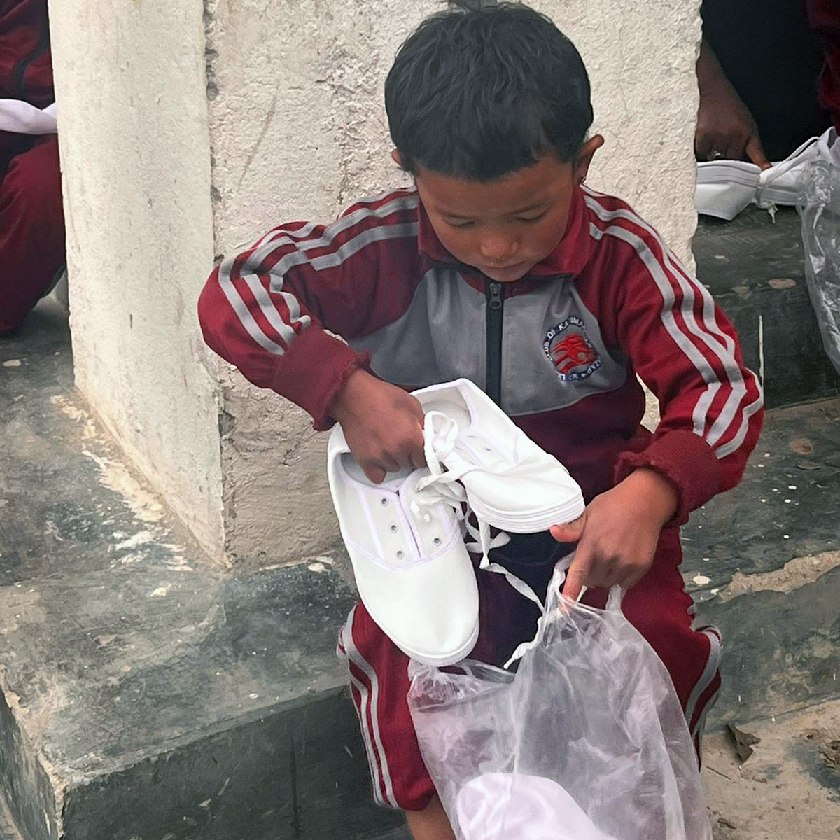 Student with new shoes provided through Trek Trainers philanthropic support